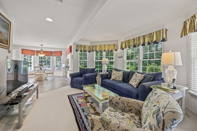 living room featuring a notable chandelier and wood-type flooring