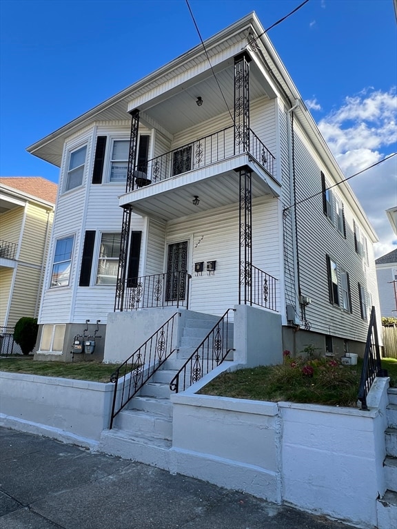 view of front of house with a balcony