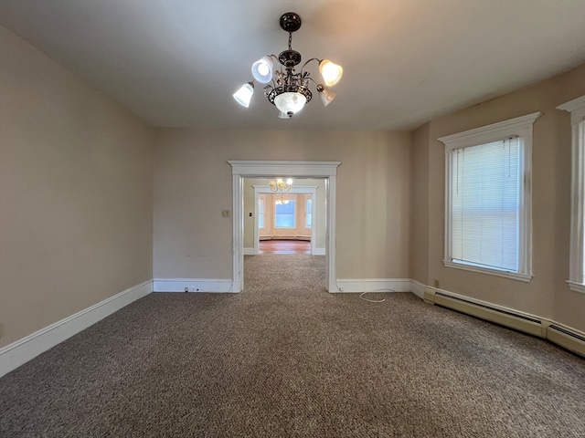 unfurnished room with an inviting chandelier, carpet flooring, and a baseboard heating unit