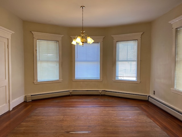 unfurnished dining area featuring dark hardwood / wood-style floors, a notable chandelier, and a baseboard radiator