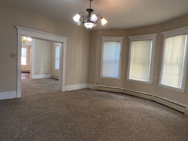 carpeted empty room featuring a notable chandelier and baseboard heating