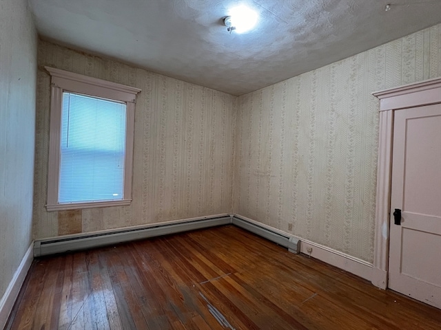 empty room featuring dark hardwood / wood-style flooring