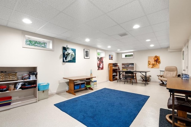 game room with recessed lighting and a paneled ceiling