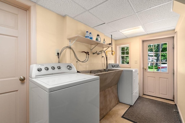 clothes washing area with washing machine and clothes dryer