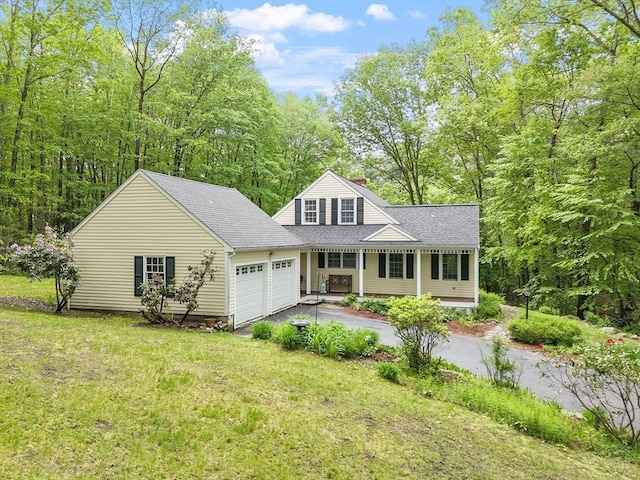 31 Spectacle Hill Rd, Bolton, MA 01740 - view of front of home featuring asphalt driveway, a garage, a shingled roof, a front yard, and a chimney