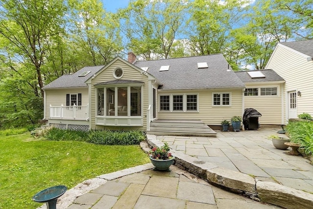 31 Spectacle Hill Rd, Bolton, MA 01740 - rear view of house with a patio, a chimney, a lawn, and a shingled roof