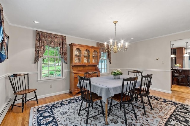 31 Spectacle Hill Rd, Bolton, MA 01740 - dining space featuring a baseboard radiator, a chandelier, light wood-style floors, ornamental molding, and baseboards
