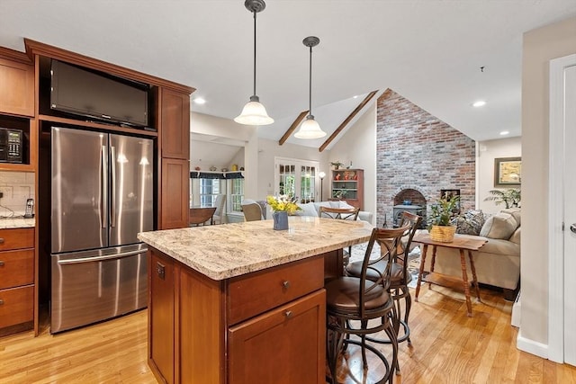 31 Spectacle Hill Rd, Bolton, MA 01740 - kitchen featuring freestanding refrigerator, open floor plan, lofted ceiling, light wood-type flooring, and decorative light fixtures