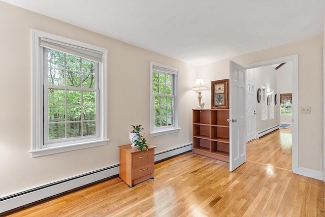 31 Spectacle Hill Rd, Bolton, MA 01740 - spare room featuring baseboard heating, light wood-style flooring, and baseboards