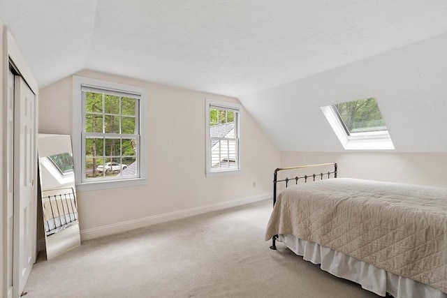 31 Spectacle Hill Rd, Bolton, MA 01740 - bedroom featuring a skylight, lofted ceiling, baseboards, and carpet flooring