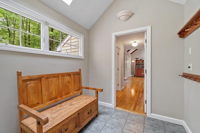31 Spectacle Hill Rd, Bolton, MA 01740 - mudroom with vaulted ceiling, baseboards, and light tile patterned flooring