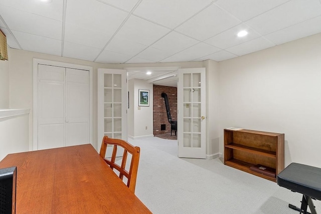31 Spectacle Hill Rd, Bolton, MA 01740 - dining room with carpet, french doors, a paneled ceiling, baseboards, and a wood stove