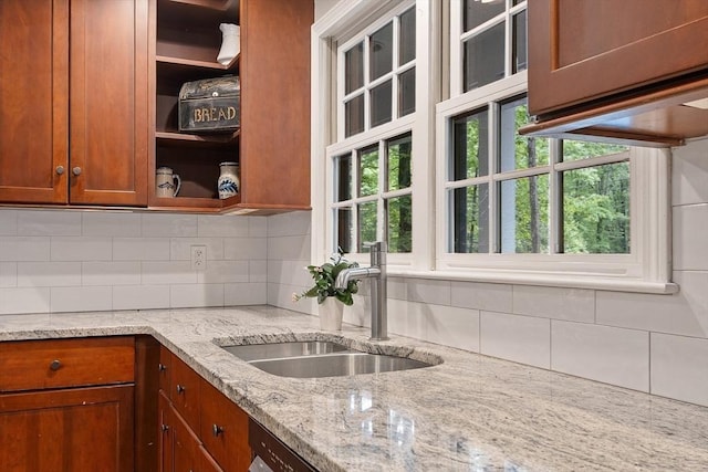 31 Spectacle Hill Rd, Bolton, MA 01740 - kitchen with a sink, brown cabinets, tasteful backsplash, light stone counters, and open shelves