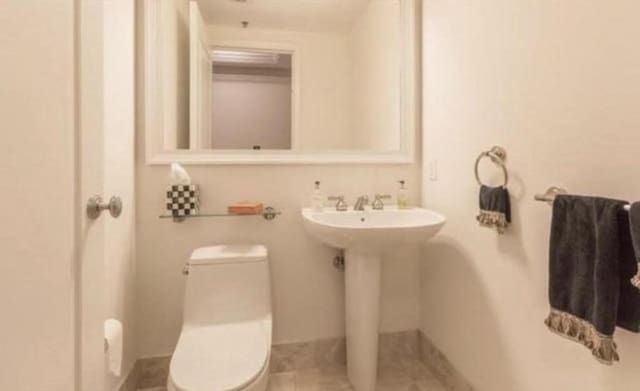 bathroom featuring toilet