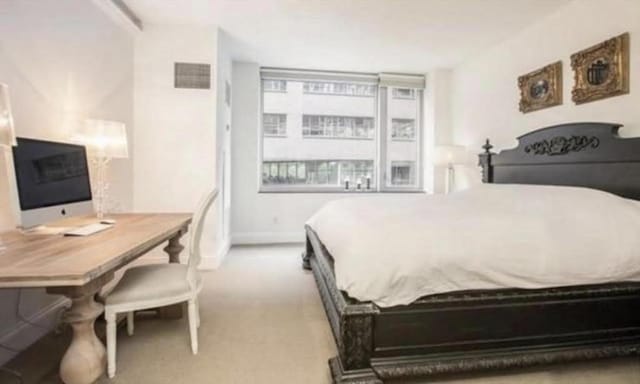 bedroom featuring visible vents and carpet floors