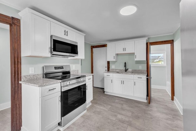 kitchen featuring sink, white cabinets, and appliances with stainless steel finishes