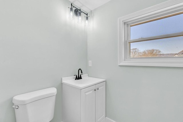 bathroom featuring toilet and vanity