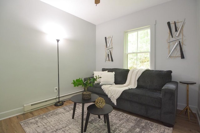 318 Charles St, Fitchburg, MA 01420 - sitting room featuring wood finished floors, baseboards, and baseboard heating