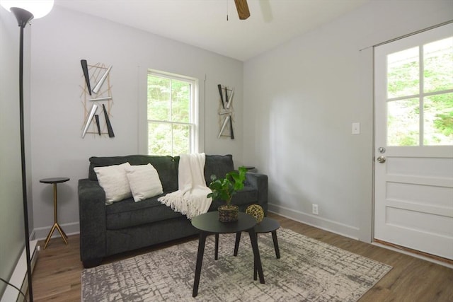 318 Charles St, Fitchburg, MA 01420 - living room with ceiling fan, plenty of natural light, wood finished floors, and baseboards