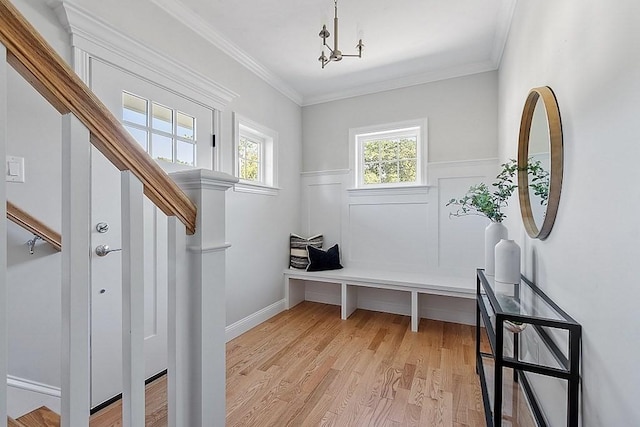 mudroom featuring light hardwood / wood-style flooring and crown molding