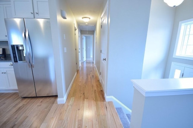 corridor featuring light hardwood / wood-style flooring