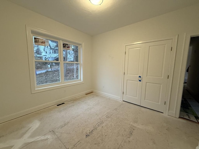 unfurnished bedroom featuring a closet