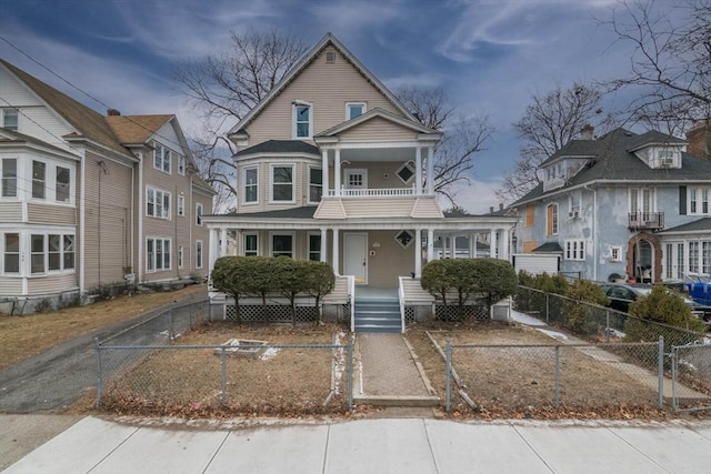 view of front facade featuring covered porch and a balcony