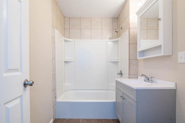 bathroom with tile patterned floors, vanity, and shower / washtub combination