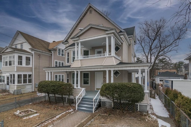 view of front of home featuring a balcony and a porch