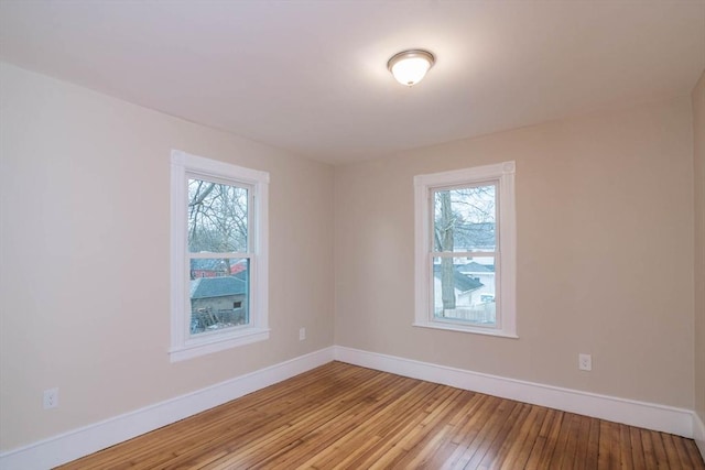 spare room with light wood-type flooring