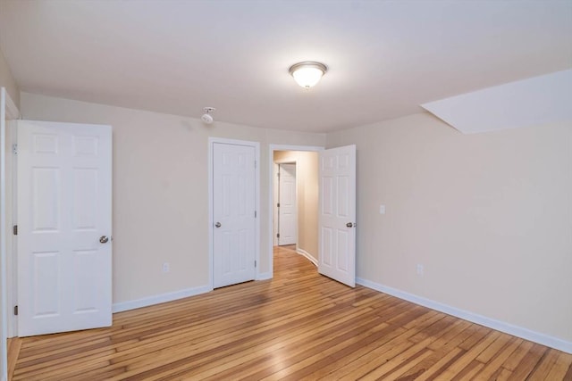 unfurnished bedroom featuring light hardwood / wood-style flooring