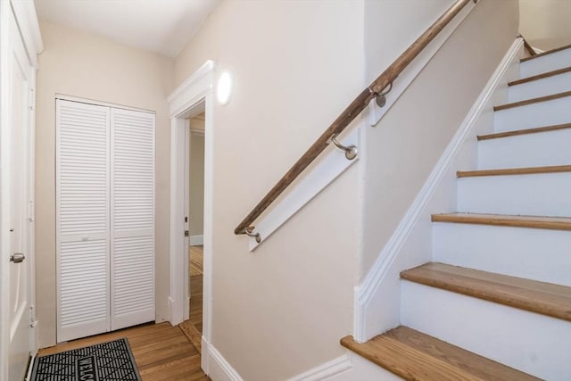 stairway featuring hardwood / wood-style floors