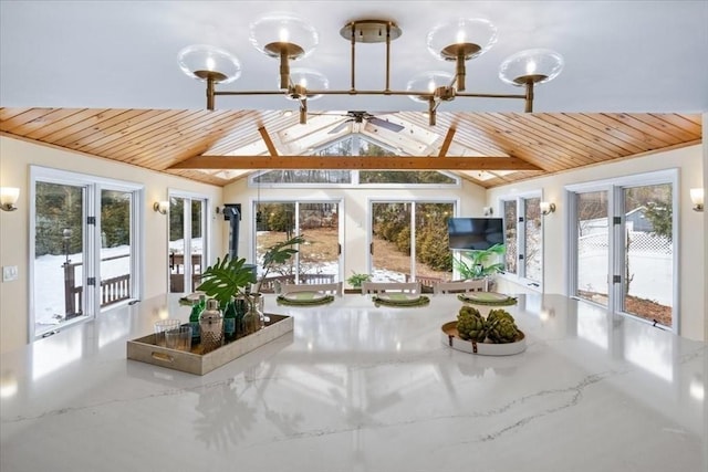 unfurnished sunroom featuring a healthy amount of sunlight, wood ceiling, and vaulted ceiling