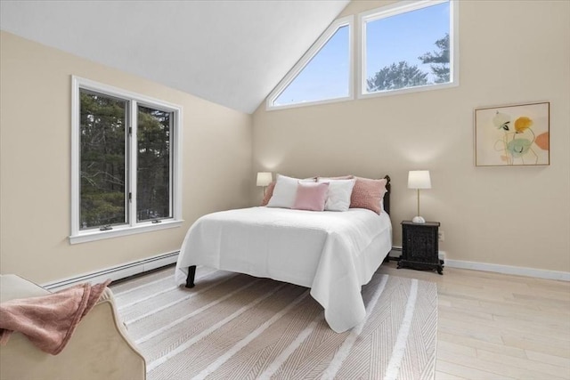 bedroom with baseboards, lofted ceiling, light wood-style flooring, a baseboard radiator, and baseboard heating