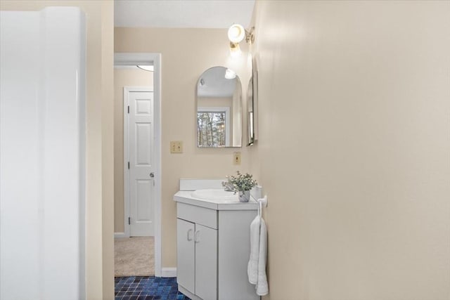 bathroom with baseboards and vanity