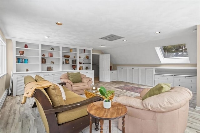 living area featuring baseboards, vaulted ceiling with skylight, light wood finished floors, and recessed lighting