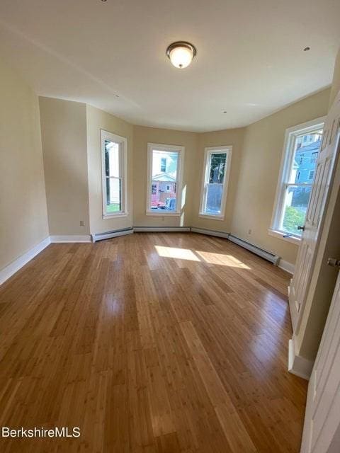 70-72 Chase Ave, North Adams, MA 01247 - empty room with wood finished floors and baseboards