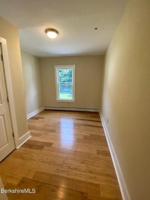 70-72 Chase Ave, North Adams, MA 01247 - empty room featuring light wood-type flooring, baseboards, and baseboard heating