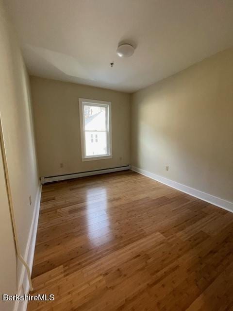 70-72 Chase Ave, North Adams, MA 01247 - spare room featuring a baseboard radiator, wood finished floors, and baseboards