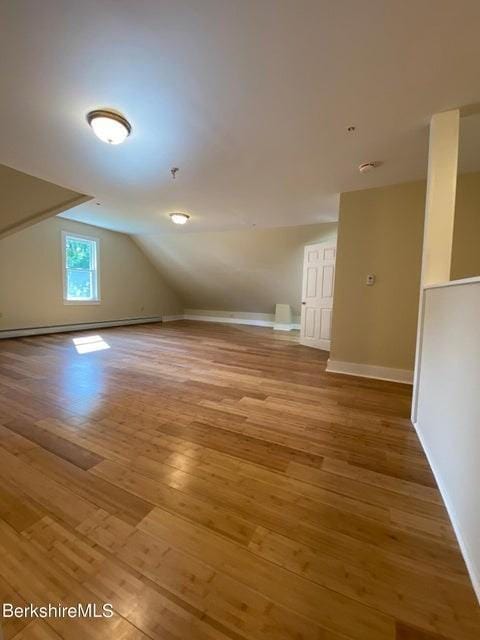 70-72 Chase Ave, North Adams, MA 01247 - bonus room with a baseboard radiator, lofted ceiling, light wood-style floors, and baseboards