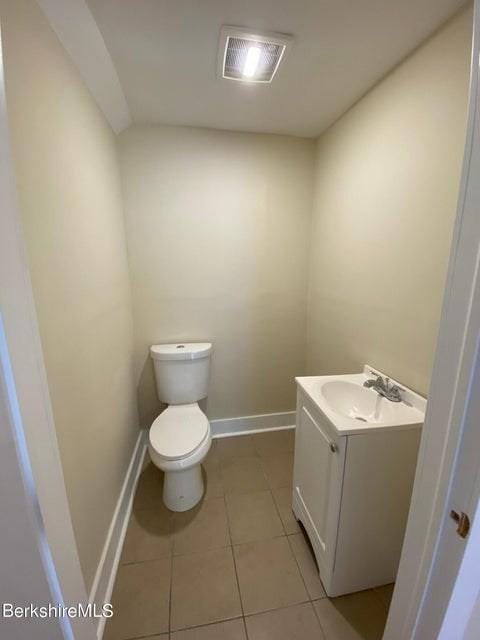 70-72 Chase Ave, North Adams, MA 01247 - bathroom featuring vanity, toilet, baseboards, and tile patterned floors