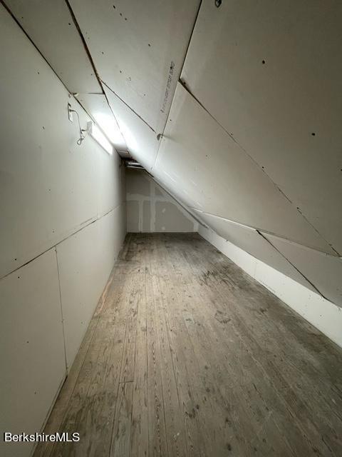 70-72 Chase Ave, North Adams, MA 01247 - additional living space featuring lofted ceiling and light wood-style floors