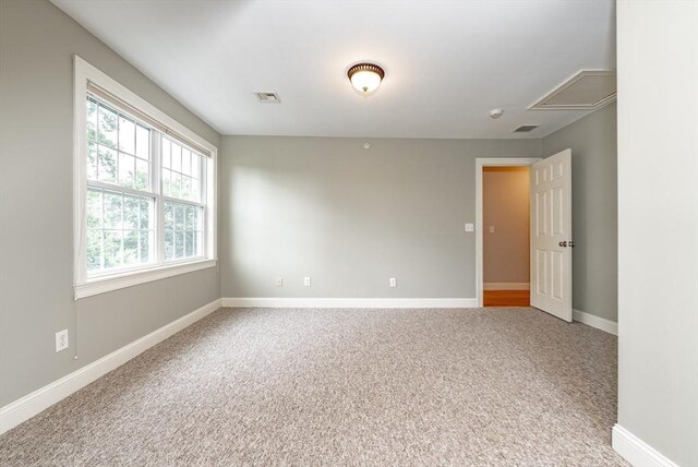 unfurnished room featuring carpet floors