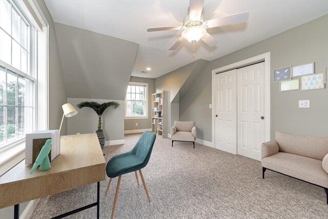 office featuring ceiling fan, carpet floors, and lofted ceiling