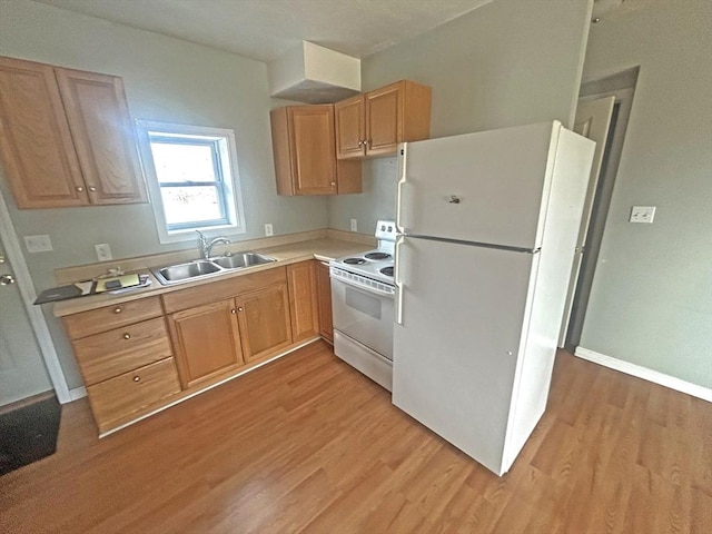 44 Howarth Rd, Oxford, MA 01540 - kitchen with white appliances, a sink, light wood-style floors, light countertops, and baseboards