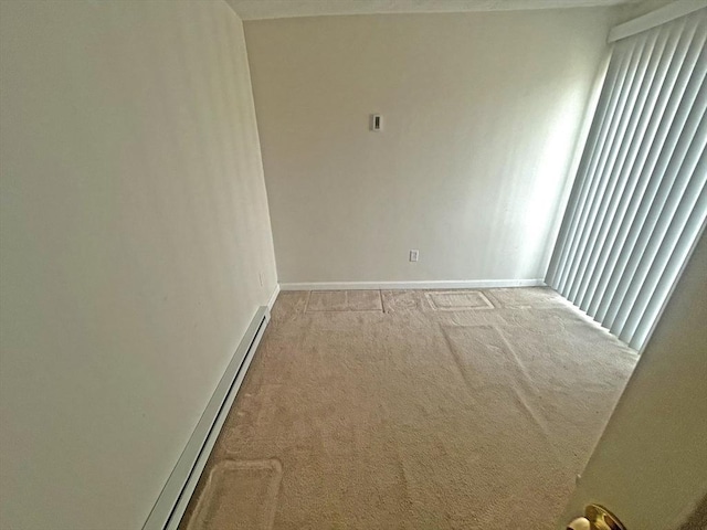 44 Howarth Rd, Oxford, MA 01540 - spare room with light carpet, baseboards, and a baseboard radiator