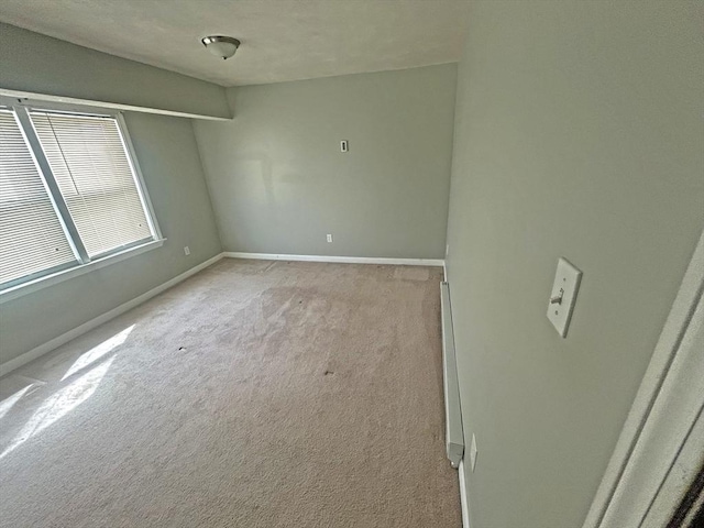 44 Howarth Rd, Oxford, MA 01540 - empty room featuring baseboards and light colored carpet