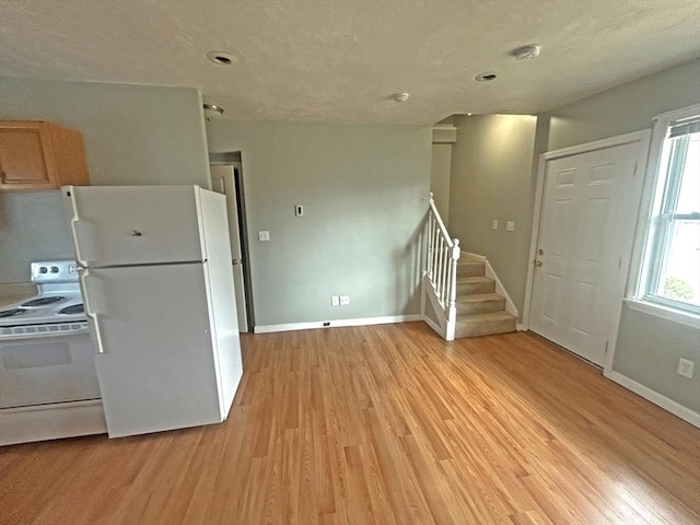 44 Howarth Rd, Oxford, MA 01540 - kitchen featuring white appliances, light wood-style floors, and baseboards
