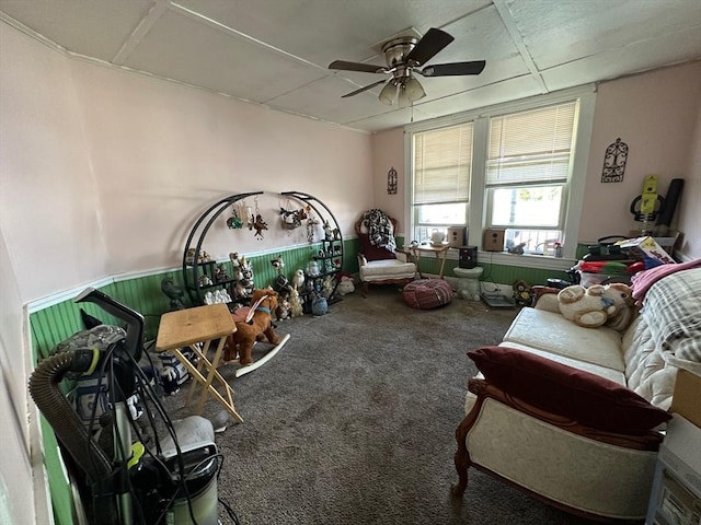 interior space with carpet floors and a ceiling fan