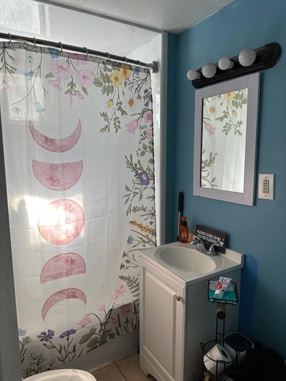 full bath with tile patterned flooring and vanity